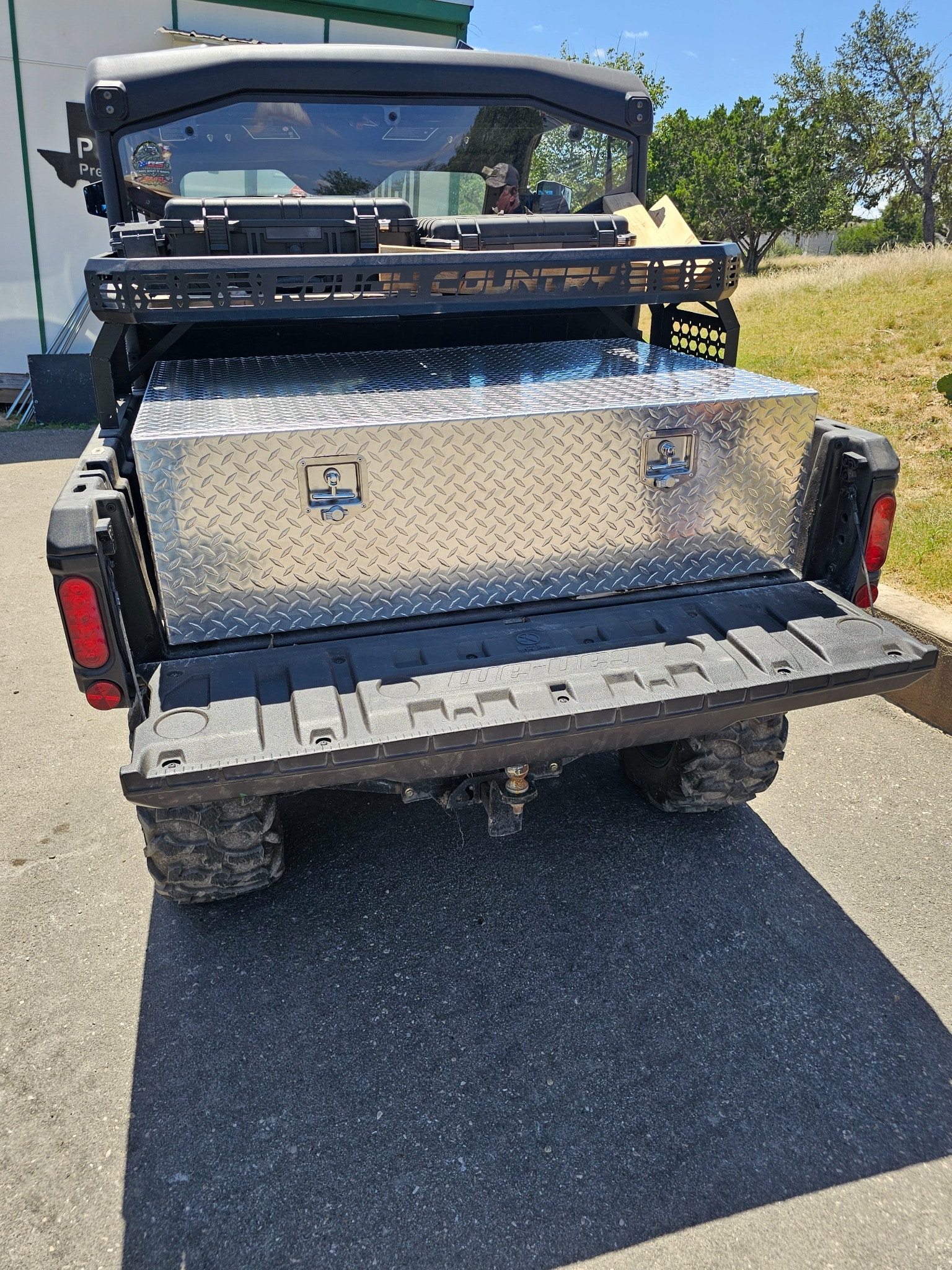 Silver TerraBoxx diamond plate storage box mounted in UTV bed