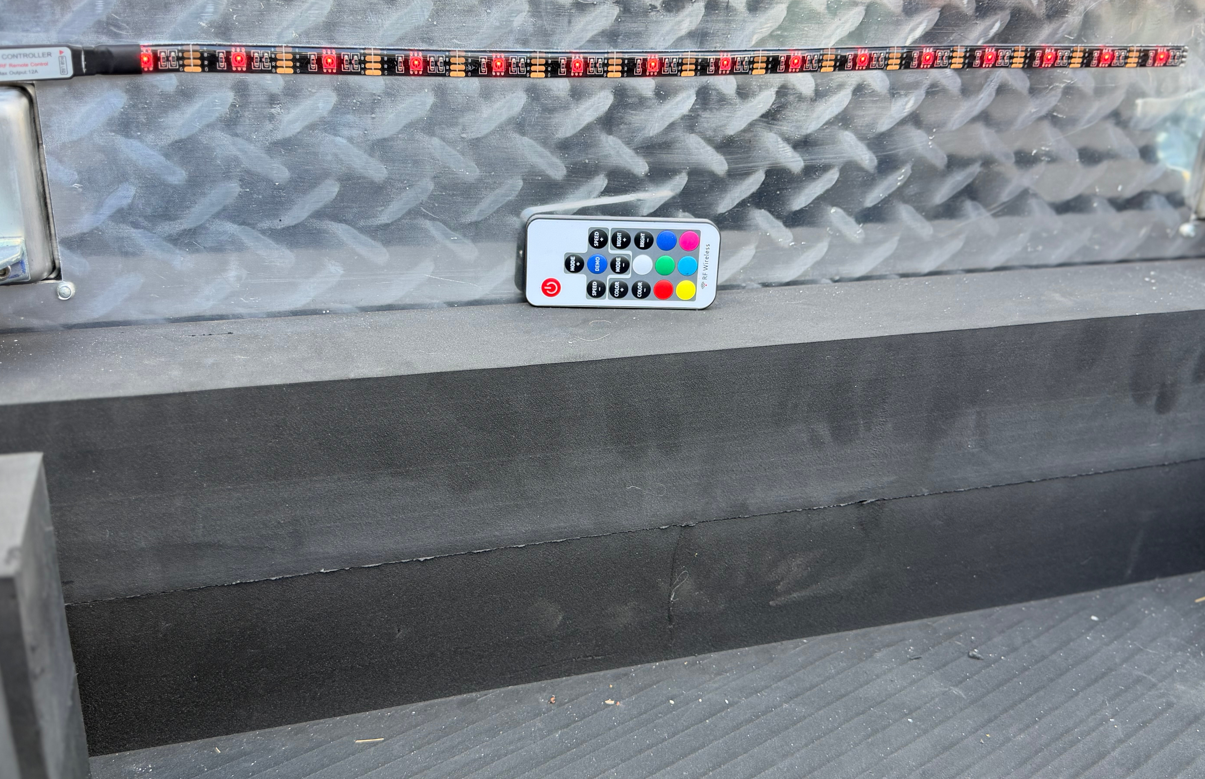Black TerraBoxx diamond plate storage box in UTV bed